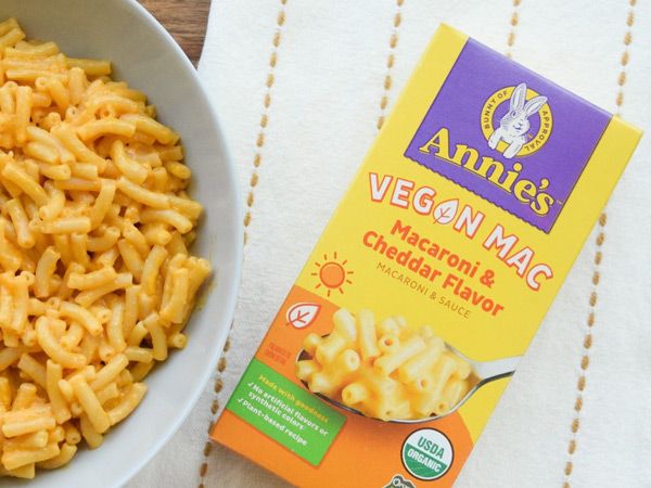 a box of Annie's Homegrown vegan mac beside a bowl of mac and cheese