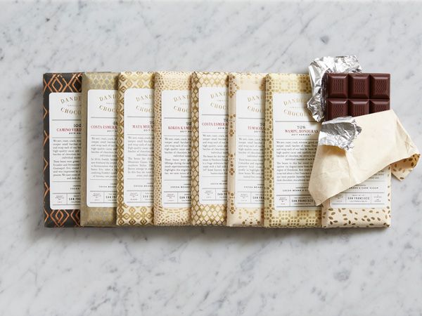 a row of dandelion chocolate bars on marble table