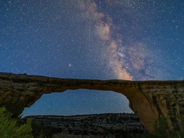 Milky way behind Natural Bridges National Monument