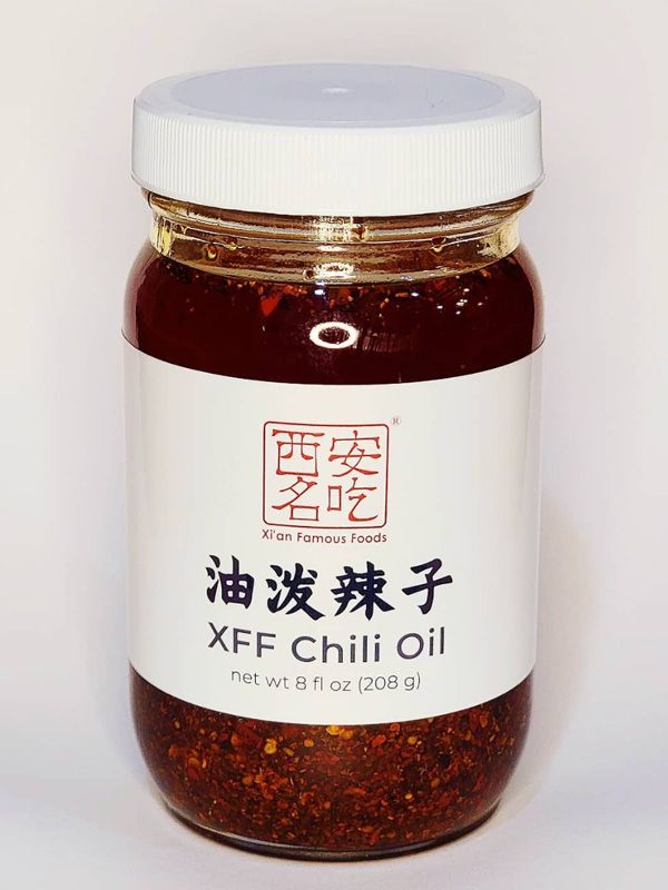 a jar of Xi'an Famous Foods chili oil on white background