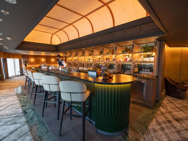 bar counter with cosy chairs at Atlas Bar