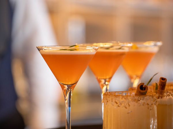 orange cocktails on a glass in Atlas Bar