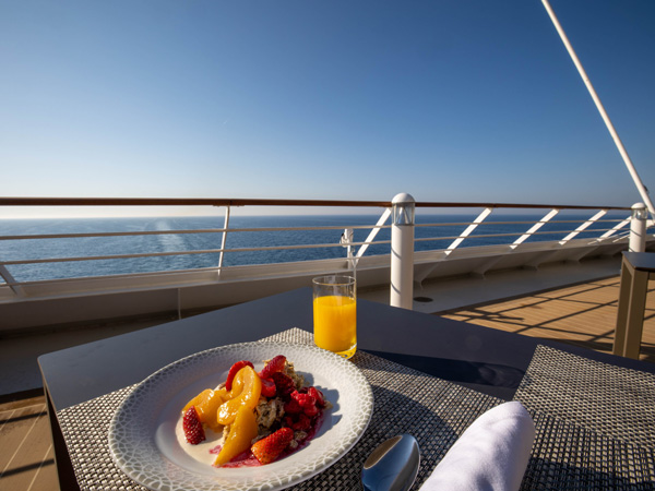 breakfast on the table facing the sea