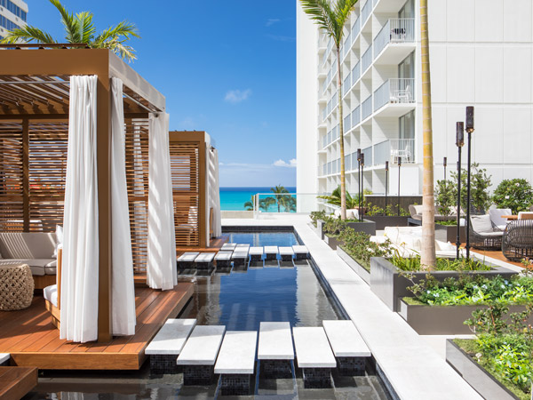 view of the outdoor pool next to the sea