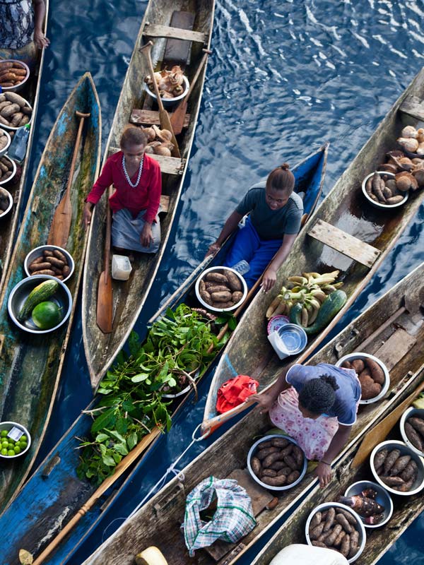 Natives selling products to a Liveaboard in Melanesia, Pacific Ocean, Solomon Islands