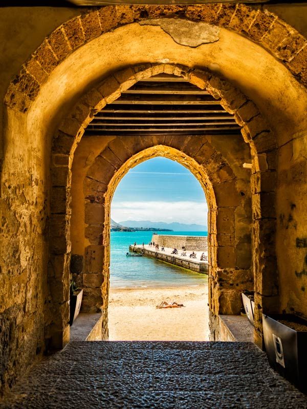 a narrow passageway that leads to the ocean in Cefalù, Sicily