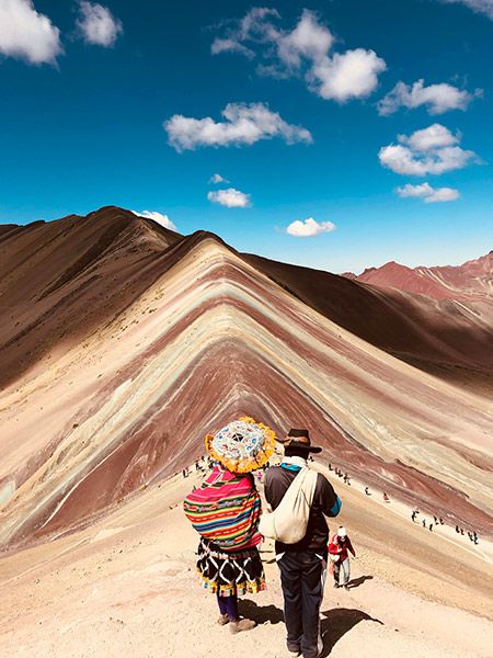 locals walking on Peru Rainbow mountains