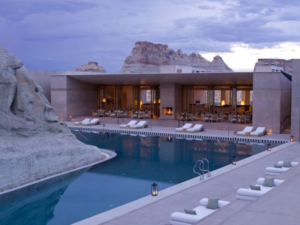 a swimming pool with loungers in the pavilion of Aman Amangiri in Utah