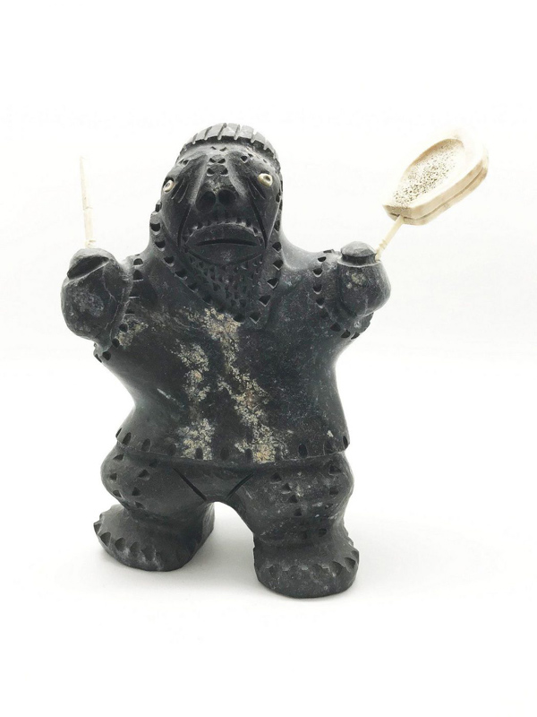 A carved drummer by Andrew Palongayoak of Gjoa Haven, Nunavut