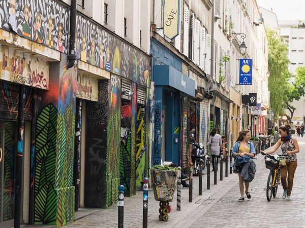 people strolling along Belleville neighbourhood in Paris