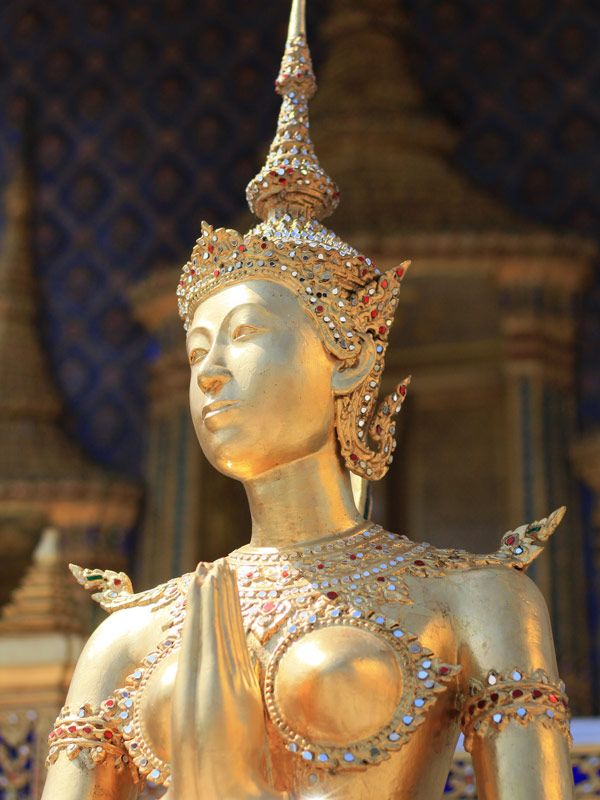 a gilded statue in the Grand Palace
