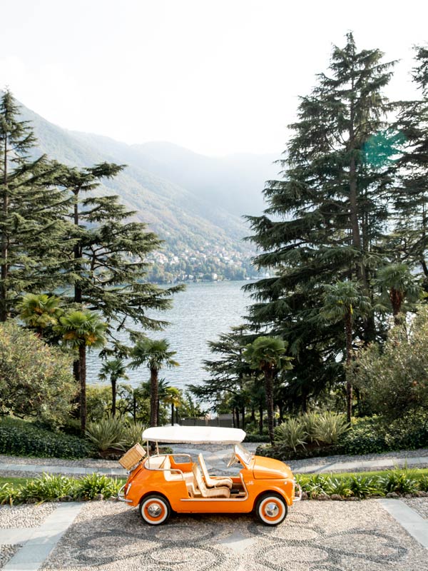 an open-top Fiat 500 touring around Passalacqua