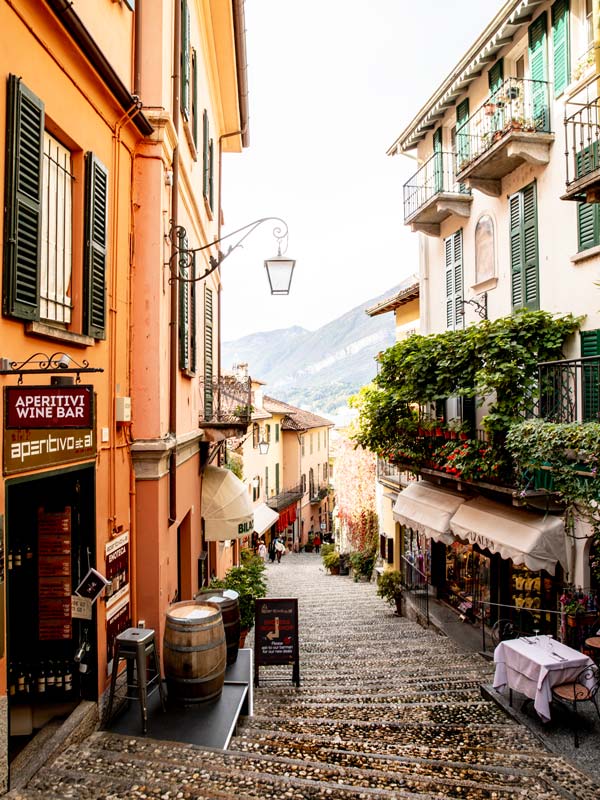 pastel-hued houses lined along cobblestoned streets in Bellagio
