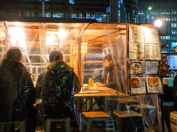customers sitting and dining on a Yatai Food Stall in Fukuoka