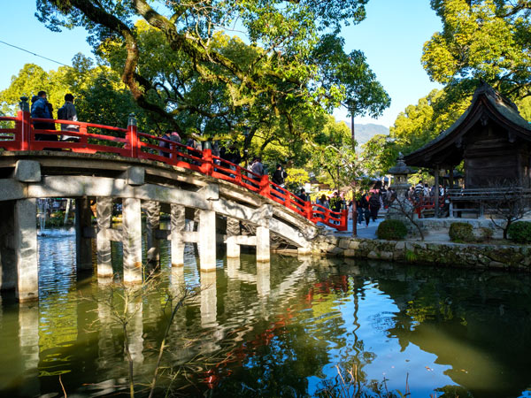 people passing through the bridge at Dazaifu Tenmangu Shrine in Fukuoka