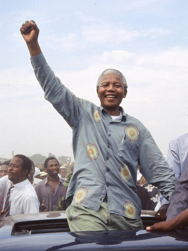 a portrait of Nelson Mandela raising his fist