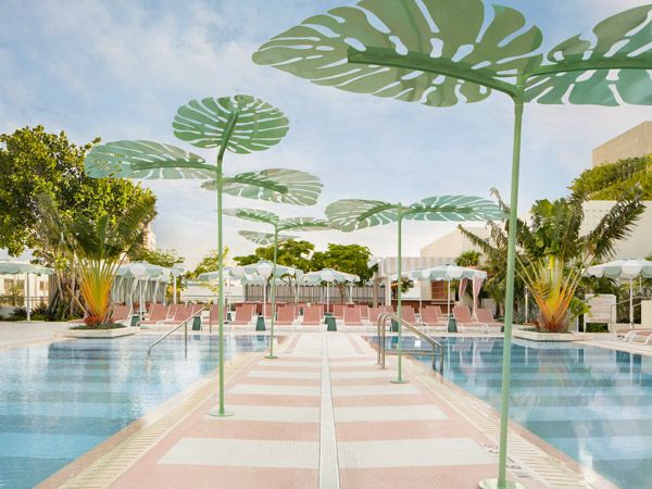 a walkway in the middle of the Strawberry Moon Pool at Goodtime Hotel