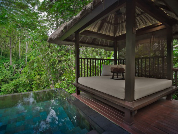 a pool beside a nipa hut at Hanging Gardens in Bali