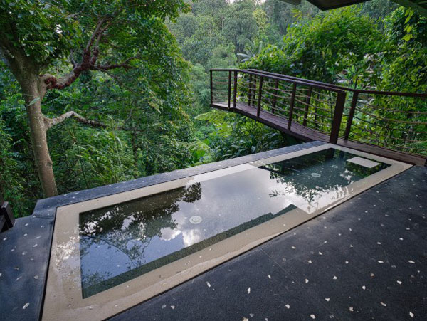 a pool with scenic nature views at Hanging Gardens in Bali