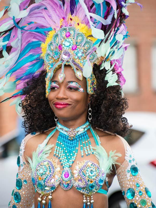 a woman wearing a colourful costume at Rio de Janeiro Carnival