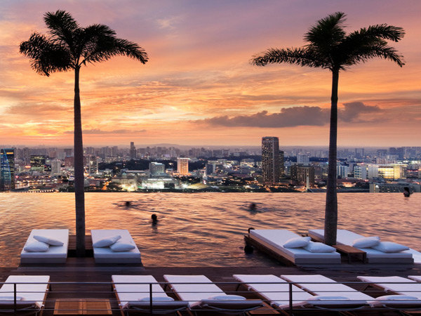 an infinity pool at Marina Bay Sands SkyPark with sunset on the backdrop