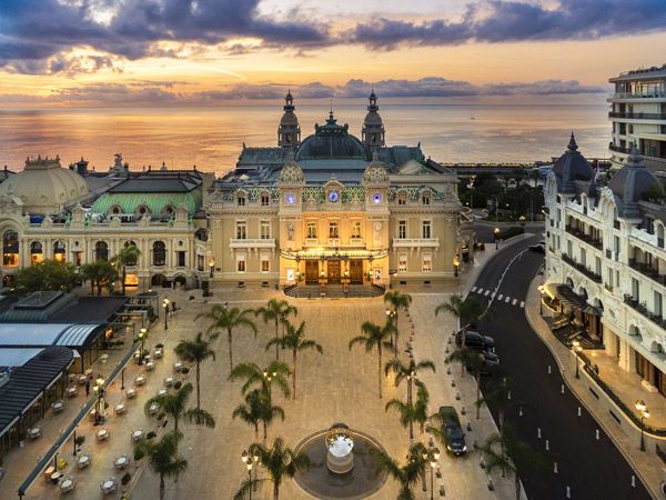 an exterior view of Belle Époque Casino de Monte-Carlo at dusk