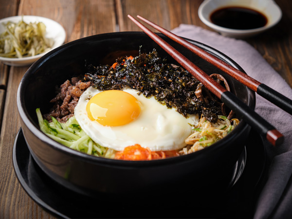 a bowl of Bibimbap on the table