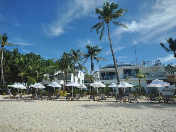 sun loungers on the beach outside Boracay Ocean Club Beach Resort