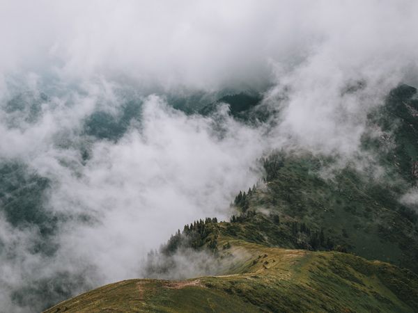 Shot of Furmanov Peak, Kazakhstan in the clouds