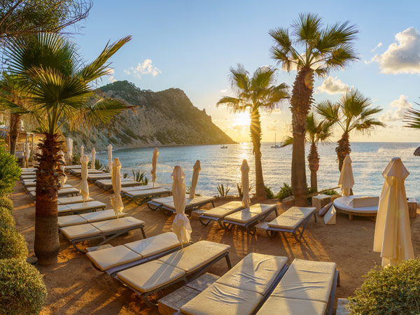 an array of sun loungers facing the sea at Ibiza Beach Club