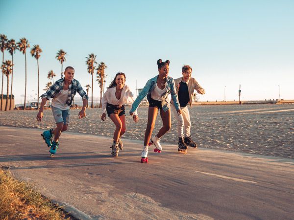 a group of teens rollerskating in LA