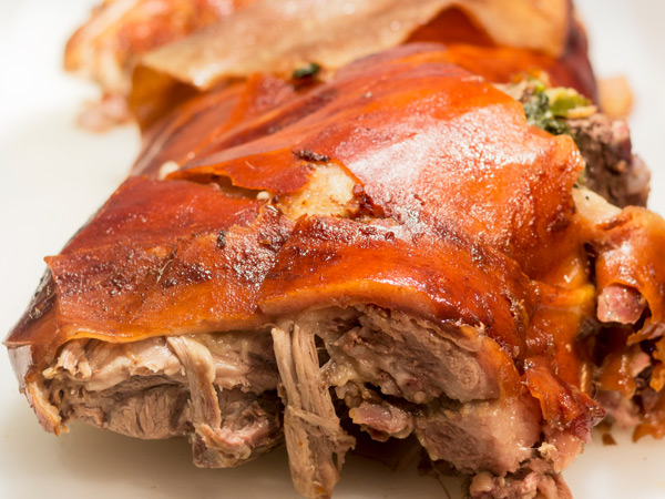 a close-up photo of a sliced Lechon in Cebu, Philippines