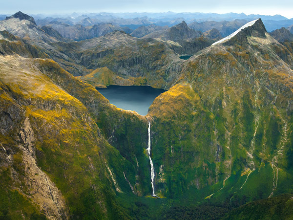 a picturesque view of the mountain peaks in Milford Sound