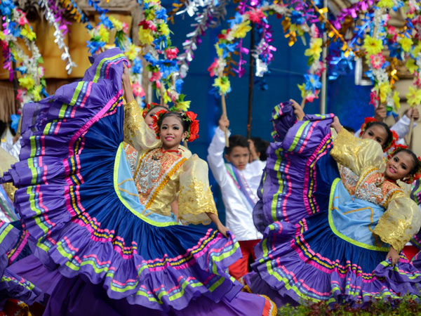 dancers wearing vibrant costumes at Sinulog Festival in Cebu, Philippines