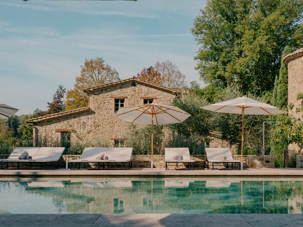 an outdoor pool with sun loungers at Vocabolo Mosacatelli