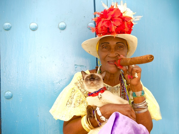 a cuban woman smoking a cigar
