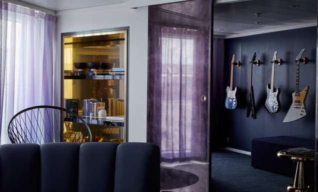 a media room stocked with four guitars at the massive suite, Virgin Voyages’ Resilient Lady