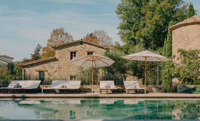 an outdoor pool with sun loungers at Vocabolo Mosacatelli