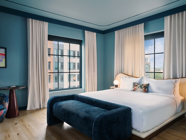 a look inside the grand king room at Hotel Genevieve