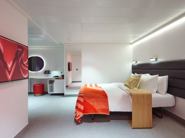the bedroom interior inside a cabin at Virgin Voyages’ Resilient Lady