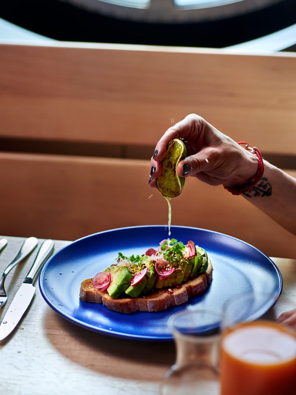 an avocado toast at Razzle Dazzle, Virgin Voyages’ Resilient Lady