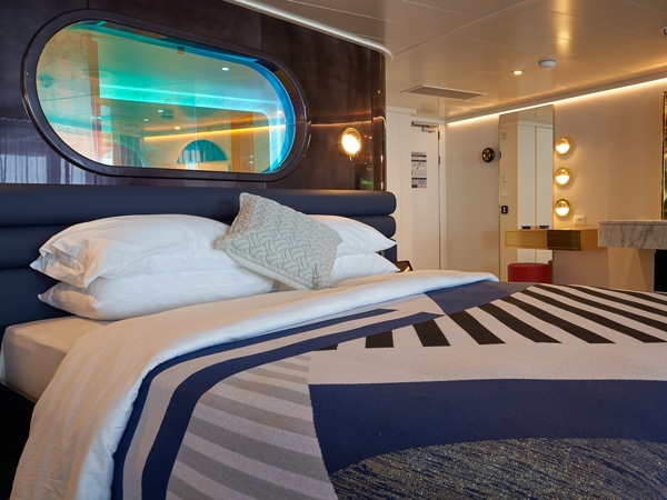 a bedroom with peekaboo window, Virgin Voyages’ Resilient Lady