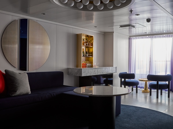 the interior of posh suite, Virgin Voyages’ Resilient Lady