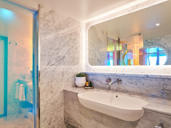 a bathroom inside Mega RockStar Suites, Virgin Voyages’ Resilient Lady