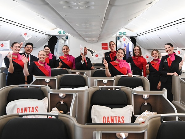 the crew of Qantas Flight QF3 Auckland to New York smiling at the camera