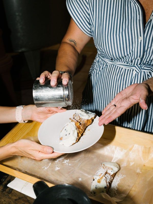 a woman sampling food at S.A.L.T program excursion