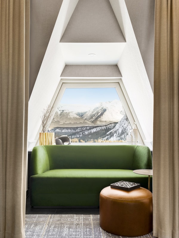 The Fairmont Banff Springs crown suite green couch by the window
