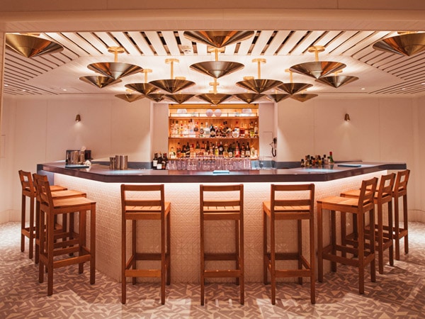 an elegant dining interior at The Dock, Virgin Voyages’ Resilient Lady