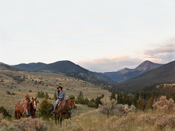 a woman riding a horse at Yellowstone Ranch, Montana
