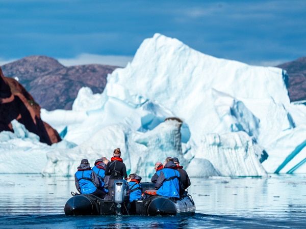 a group of cruisers stopping by a glacier at Greenland